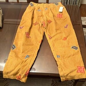 Urban Outfitters Mustard Corduroy Pants with Colorful Letter Patches